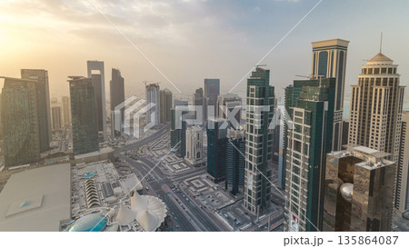 Skyscrapers before sunset timelapse in the skyline of commercial center of Doha 135864087