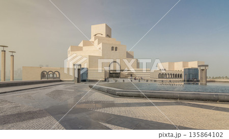 Qatar's museum of Islamic Art timelapse hyperlapse on its man-made island beside Doha Corniche 135864102
