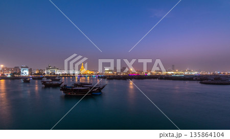 Evening at Doha Bay day to night timelapse with Traditional Wooden Dhow Fishing Boats. Evening at Doha Bay day to night timelapse with Traditional Wooden Dhow Fishing Boats. 135864104