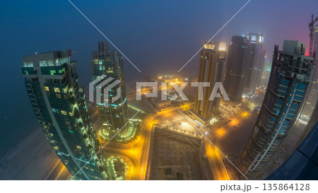 The skyline of the West Bay area from top in Doha day to night timelapse, Qatar. The skyline of the West Bay area from top in Doha day to night timelapse, Qatar. 135864128