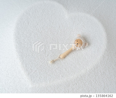 Baby pacifier placed inside heart shape on soft white background. Minimal newborn concept, love, care, parenthood and early childhood symbol Baby pacifier placed inside heart shape on soft white background. Minimal newborn concept, love, care, parenthood and early childhood symbol 135864162