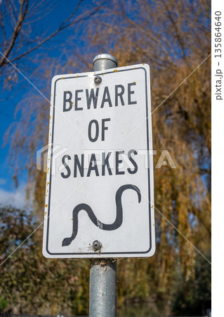 Warning sign about snake danger near Lake Colac, Victoria, Australia 135864640