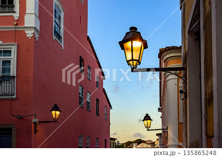 Houses illuminated by streetlights 135865248