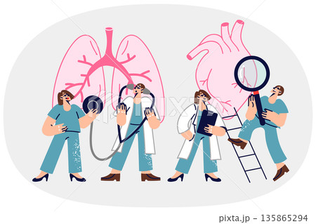 Consilium doctors examining patient giant heart and lungs to look for symptoms of disease 135865294