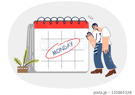 Exhausted man feels burnout on monday, stands near large calendar and does not want to go to work Exhausted man feels burnout on monday, stands near large calendar and does not want to go to work 135865326