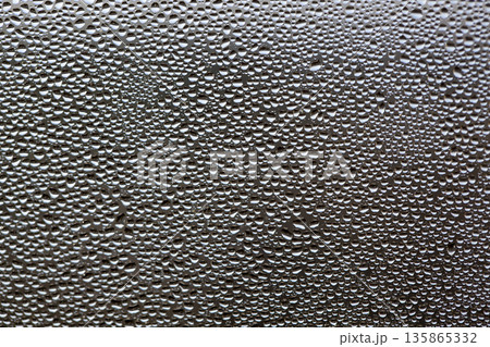 A background of a huge number of water droplets on glass 135865332