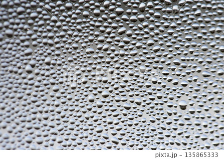 A background of a huge number of water droplets on glass A background of a huge number of water droplets on glass 135865333