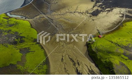Aerial View of Volcanic Landscape with Moss and River in Iceland 135865512
