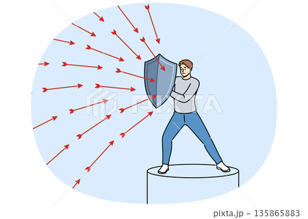 Brave man defends himself from problems using shield to deflect flying arrows from enemies 135865883