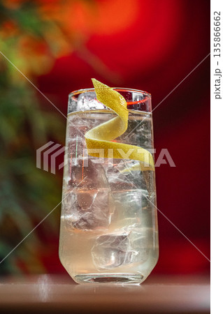 Clear cocktail with lemon twist and ice Clear cocktail with lemon twist and ice 135866662
