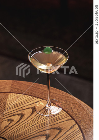 Classic martini cocktail with olive garnish Classic martini cocktail with olive garnish 135866668