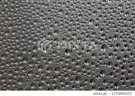 A background of a huge number of water droplets on glass A background of a huge number of water droplets on glass 135866923