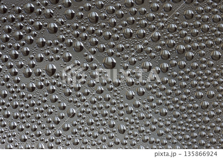 A background of a huge number of water droplets on glass A background of a huge number of water droplets on glass 135866924
