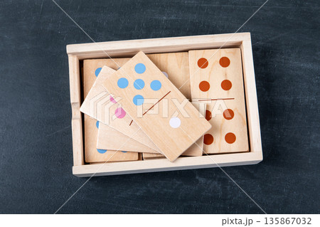 Wooden Domino Tiles Stored In Box On Dark Background 135867032