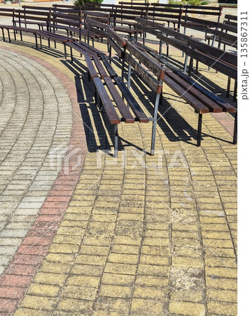 benches on a paved square 135867311