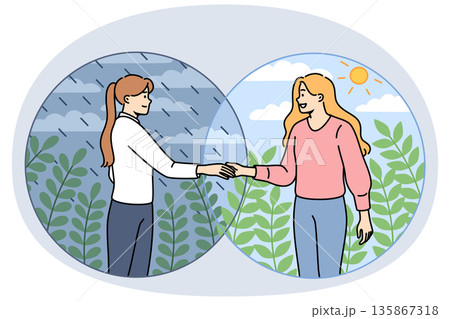 Woman helps friend get rid of depression, standing in rain and inviting to sunny place Woman helps friend get rid of depression, standing in rain and inviting to sunny place 135867318