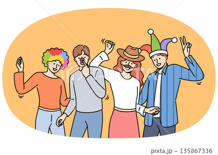 Group of friends participating in masquerade, dancing and enjoying festive party 135867336