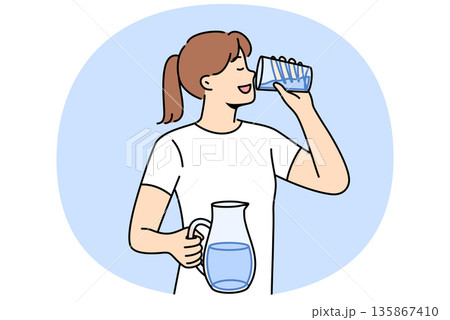 Woman drinks clean water from glass to refresh herself and saturate body with mineral aqua 135867410