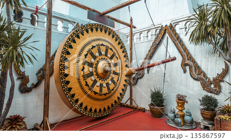golden gong with mallet in Wat Saket Buddhist temple, Ritual Thai gong golden gong with mallet in Wat Saket Buddhist temple, Ritual Thai gong 135867597