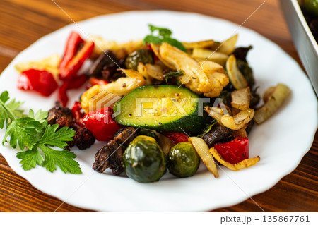 Organic roasted vegetables served with herbs and seasoning Organic roasted vegetables served with herbs and seasoning 135867761