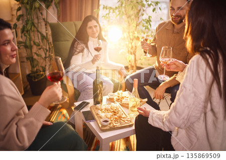 Group wine tasting with red and white wine at home. Group wine tasting with red and white wine at home. 135869509