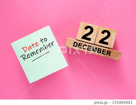 Date December 22 to remember concept with sticky note and wooden calendar Date December 22 to remember concept with sticky note and wooden calendar 135869881