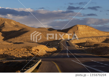 Scenic winding road through the desert. The highway connects Eilat city to the center of the country. Israel. Scenic winding road through the desert. The highway connects Eilat city to the center of the country. Israel. 135870204