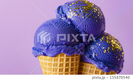 Photorealistic vibrant blue ice cream scoops stacked in a golden waffle cone, detailed textures and natural lighting 135870540
