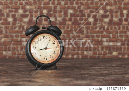 Vintage Black Alarm Clock on rusty metal Against Brick Wall Background, Retro Time Concept 135871539