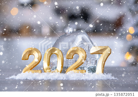Golden figures number 2027 New Year against the background of tiny house with warm light and garlands. Greeting card, Happy New Year, cozy home Golden figures number 2027 New Year against the background of tiny house with warm light and garlands. Greeting card, Happy New Year, cozy home 135872051