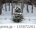 Christmas tree was decorated with Christmas tree decorations in a snowy forest 135872261