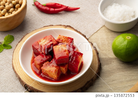 Fermented bean curd in white plate(Red Sufu) ,Chinese Cheese 135872553