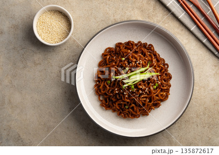 korean Jajangmyeon instant noodles.Korean black spaghetti with roasted chajang sauce korean Jajangmyeon instant noodles.Korean black spaghetti with roasted chajang sauce 135872617