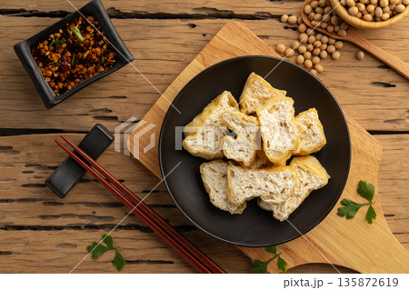 Deep fried tofu in black plate. Deep fried tofu in black plate. 135872619