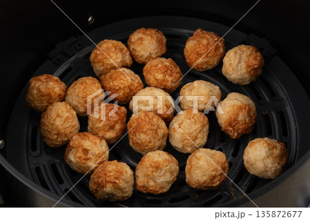 Cooked Thai pork Meatballs in Air Fryer pot.Easy Cooking. 135872677