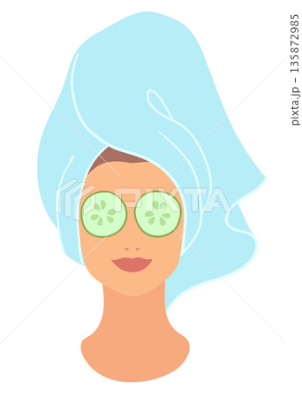 Woman with cucumber on eyes 135872985