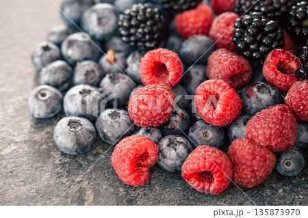Background from different berries, raspberries, blueberries and blackberries. 135873970