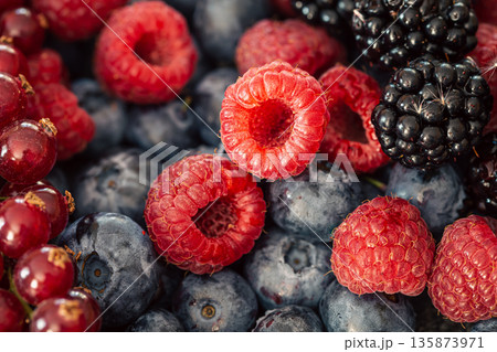 Background from different berries, raspberries, blueberries and blackberries. Background from different berries, raspberries, blueberries and blackberries. 135873971