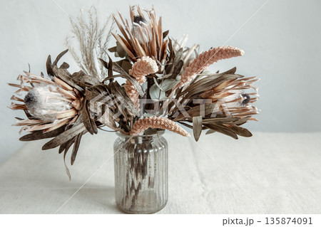 Arrangement of dried flowers in a glass vase close up. Arrangement of dried flowers in a glass vase close up. 135874091