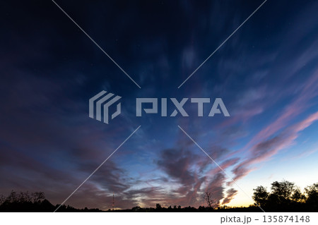 Bright contrasting blue sky with color gradient. 135874148