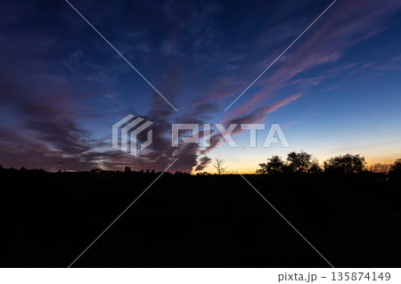 Bright contrasting blue sky with color gradient. 135874149