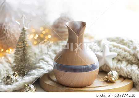 Christmas still life with an aroma diffuser for moisturizing the air. 135874219