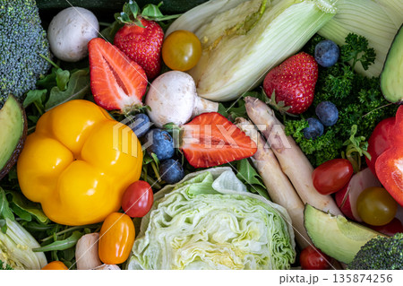 Close-up, bright fresh vegetables, fruits and berries. 135874256