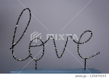Close-up, the word love on a colored background. Close-up, the word love on a colored background. 135874355