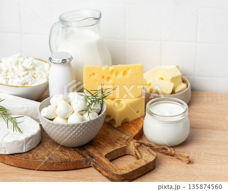 Assortment of fresh dairy products on wooden table Assortment of fresh dairy products on wooden table 135874560