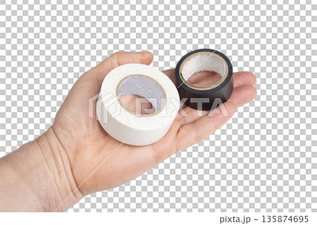 a roll of white and black electrical tape on the palm of your hand a roll of white and black electrical tape on the palm of your hand 135874695