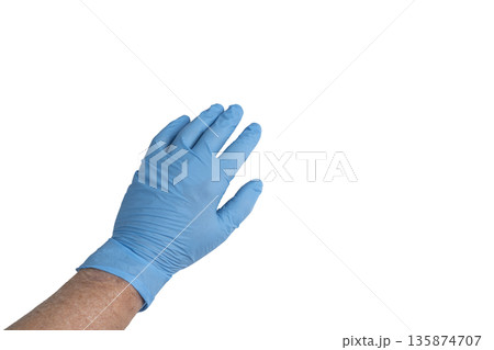 a male hand with a blue glove 135874707