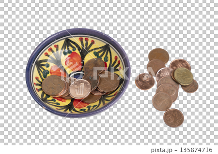a bowl decorated with some euro coins a bowl decorated with some euro coins 135874716