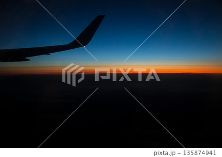 shooting from an airplane window shooting from an airplane window 135874941