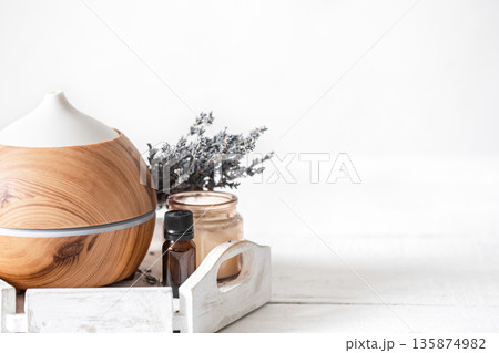Spa composition with aroma diffuser and natural lavender oil copy space. 135874982